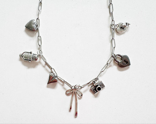 Lover of Music, Photography and all things Bow Necklace